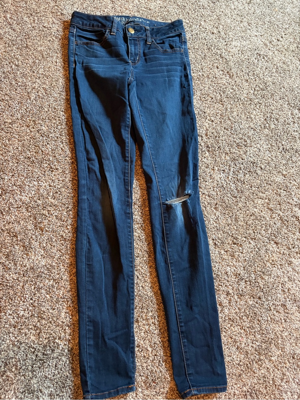 American Eagle Outfitters Navy Skinny Jeans with Knee Rip